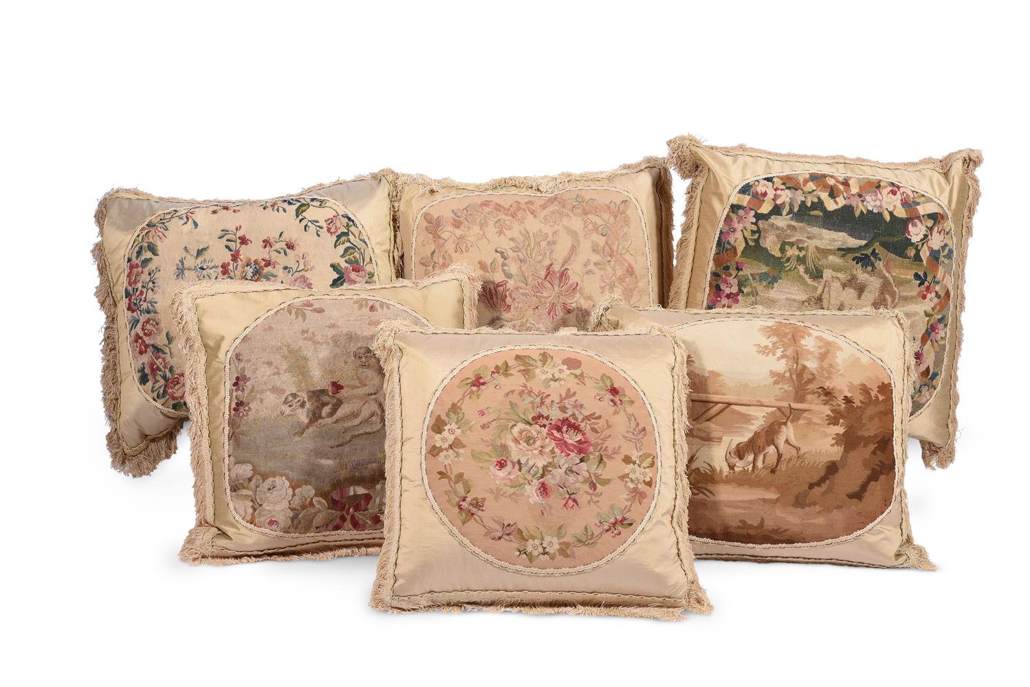 SIX LARGE CUSHIONS INCORPORATING 18TH CENTURY TAPESTRY AND LATER FABRIC