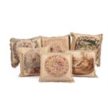SIX LARGE CUSHIONS INCORPORATING 18TH CENTURY TAPESTRY AND LATER FABRIC