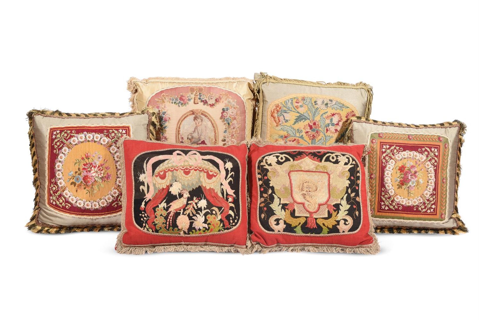 SIX LARGE CUSHIONS INCORPORATING 18TH CENTURY AND LATER WOOLWORK AND TAPESTRY AND LATER FABRIC