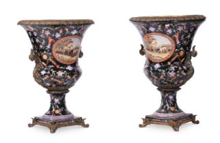 A PAIR OF ASIAN PORCELAIN BLACK GROUND URNS WITH GILT METAL MOUNTS