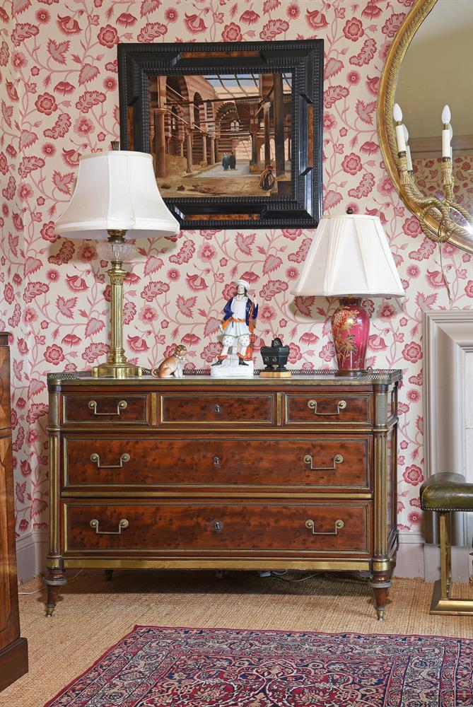 A DIRECTOIRE 'PLUM PUDDING' MAHOGANY AND GILT METAL MOUNTED COMMODE, CIRCA 1795