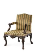 A MAHOGANY OPEN ARMCHAIR IN MID 18TH CENTURY STYLE