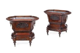 A PAIR OF CARVED MAHOGANY WINE COOLERS OR JARDINIERES IN EARLY 19TH CENTURY STYLE