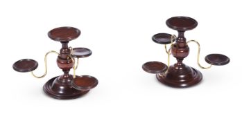 A PAIR OF MAHOGANY CENTRE PIECES WITH THREE BRASS ARMS ON A TURNED FOOT