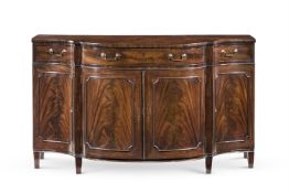 A LATE GEORGE III MAHOGANY SERPENTINE COMMODE, THIRD QUARTER 18TH CENTURY
