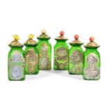 A SET OF SIX ITALIAN GREEN GLASS STORAGE JARS AND COVERS WITH FRUIT FINIALS