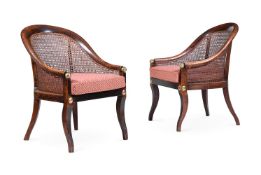 A PAIR OF REGENCY SIMULATED ROSEWOOD AND GILT BRASS MOUNTED BERGERE ARMCHAIRS, CIRCA 1820