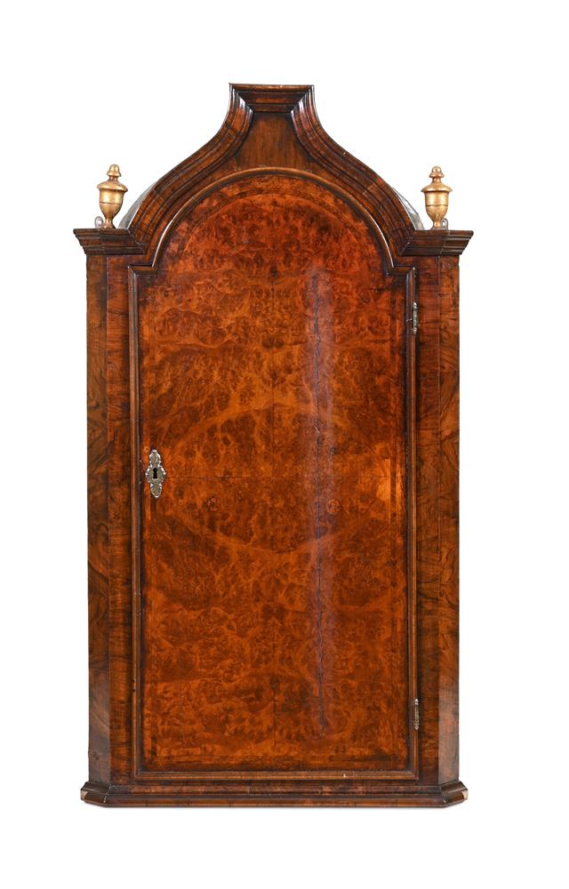 A GEORGE I MULBERRY AND WALNUT HANGING CORNER CUPBOARD, CIRCA 1720