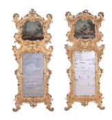 A PAIR OF ITALIAN CARVED GILTWOOD TRUMEAU MIRRORS, 19TH CENTURY