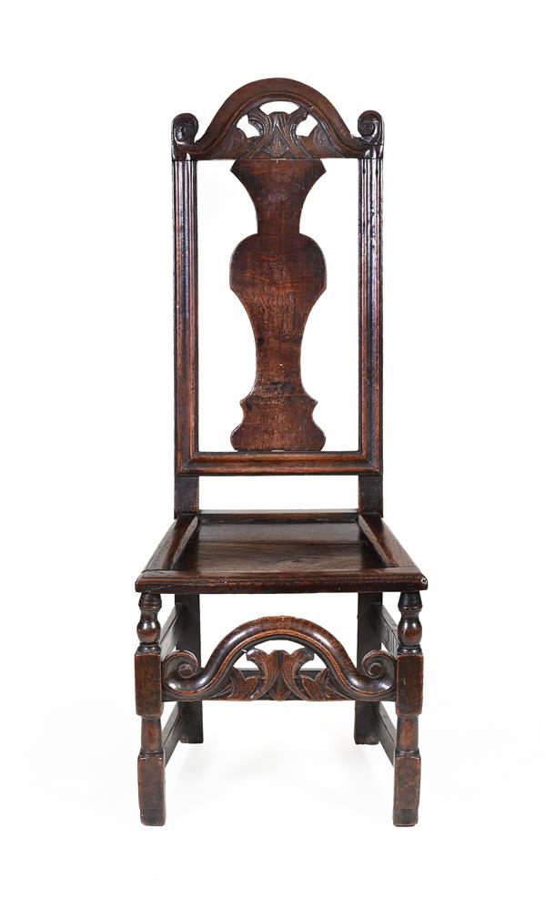 A JAMES II CARVED OAK CHAIR, CIRCA 1685