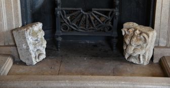 A PAIR OF CARVED GREY STONE LION KEYSTONES, PROBABLY LATE 18TH CENTURY