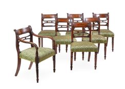 A SET OF SEVEN REGENCY MAHOGANY AND UPHOLSTERED DINING CHAIRS IN THE MANNER OF GILLOWS, CIRCA 1820