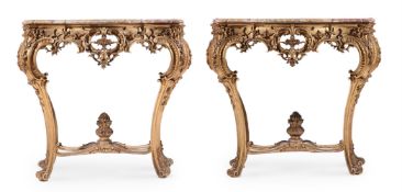 A PAIR OF FRENCH CARVED GILTWOOD SERPENTINE CONSOLE TABLES IN LOUIS XV STYLE