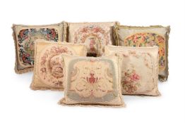 SIX LARGE CUSHIONS INCORPORATING 18TH CENTURY AND LATER WOOLWORK AND TAPESTRY AND LATER FABRIC