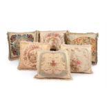 SIX LARGE CUSHIONS INCORPORATING 18TH CENTURY AND LATER WOOLWORK AND TAPESTRY AND LATER FABRIC