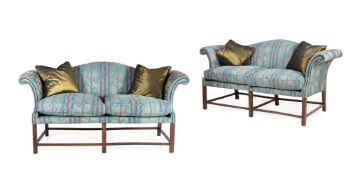 A PAIR OF BEECH AND UPHOLSTERED SOFAS, IN GEORGE III STYLE