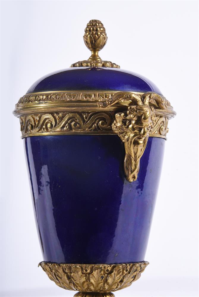 A PAIR OF SEVRES-STYLE BLUE-GROUND PORCELAIN AND GILT-METAL MOUNTED TWO-HANDLED URNSLATE 19TH CENTU - Image 2 of 3