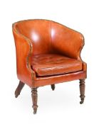 AN EARLY VICTORIAN OAK AND RED LEATHER UPHOLSTERED TUB ARMCHAIR MID 19TH CENTURY