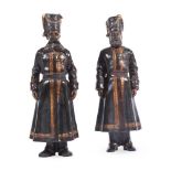 A PAIR OF RUSSIAN BRONZED AND GILT METAL MODELS OF COSSACK SOLDIERS