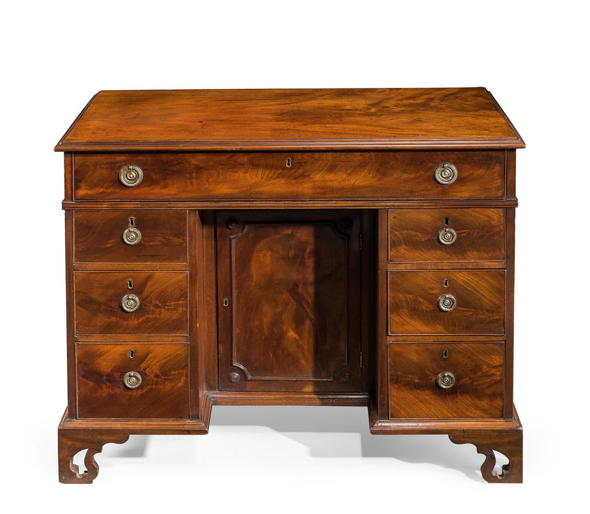 A GEORGE III MAHOGANY KNEEHOLE DESK IN THE MANNER OF THOMAS CHIPPENDALE, CIRCA 1780
