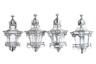 A SET OF FOUR PAINTED METAL AND GLAZED HANGING LANTERNS