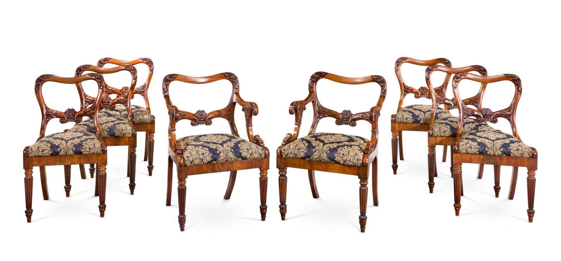 A SET OF EIGHT GEORGE IV CARVED MAHOGANY DINING CHAIRS ATTRIBUTED TO GILLOWS, CIRCA 1825