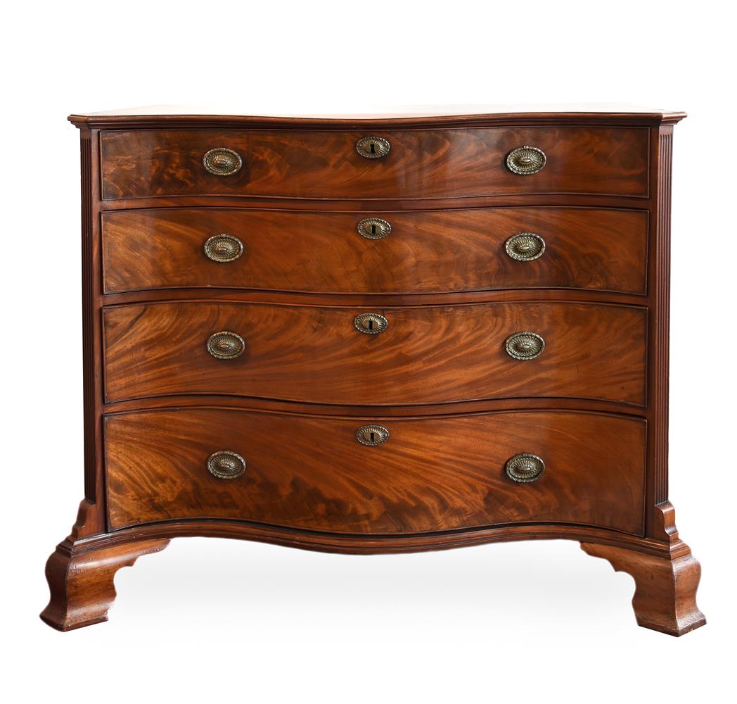 A GEORGE III MAHOGANY SERPENTINE COMMODE, CIRCA 1770