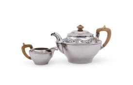 Y AN AUSTRIAN SILVER CIRCULAR TEA POT AND CREAM JUG
