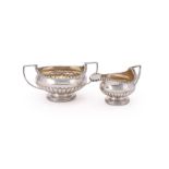 A GEORGE III SILVER SUGAR BOWL AND CREAM JUG