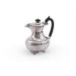 AN EDWARDIAN SILVER OBLONG BALUSTER COFFEE POT