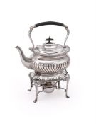 AN EDWARDIAN SILVER OBLONG BALUSTER KETTLE ON STAND