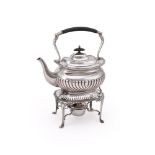 AN EDWARDIAN SILVER OBLONG BALUSTER KETTLE ON STAND