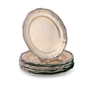 A SET OF TWELVE SILVER COLOURED SHAPED CIRCULAR PLATES