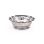 A SILVER SHAPED CIRCULAR BASKET