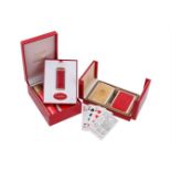 MUST DE CARTIER, A GILT METAL AND RED LACQUER LIGHTER