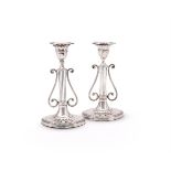 A PAIR OF LATE VICTORIAN SILVER CANDLESTICKS