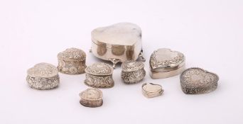 A COLLECTION OF SILVER HEART SHAPED BOXES