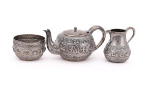 Y AN INDIAN SILVER CIRCULAR THREE PIECE TEA SET