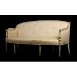 A PAINTED AND PARCEL GILT SOFA IN REGENCY STLE