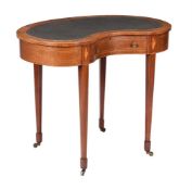 AN EDWARDIAN KIDNEY SHAPED WRITING TABLE