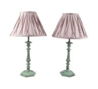 A PAIR OF VERDISGRIS PATINATED CANDLESTICKS