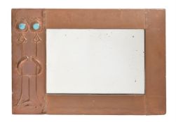 AN ARTS AND CRAFTS COPPER WALL MIRROR
