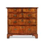 A GEORGE II WALNUT CHEST OF DRAWERS