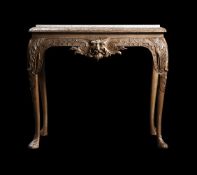 A CARVED WOOD AND SILVERED SIDE TABLE IN GEORGE I STYLE