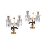 A PAIR OF REGENCY PATINATED AND GILT METAL TABLE TWIN BRANCH CANDELABRA