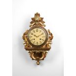 A SWEDISH GILTWOOD CARTEL WALL CLOCK IN 19TH CENTURY STYLE