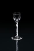 AN OPAQUE-TWIST CORDIAL GLASSTHIRD QUARTER 18TH CENTURYThe ogee bowl supported on a 'corkscrew' st
