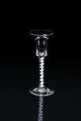 AN OPAQUE-TWIST WINE GLASSTHIRD QUARTER 18TH CENTURYThe waisted bucket bowl on a corkscrew stem an