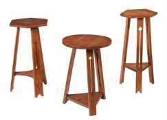 A GROUP OF THREE SIMILAR OAK OCCASIONAL TABLES OR STANDS