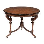 A VICTORIAN WALNUT AND EBONISED CENTRE TABLE